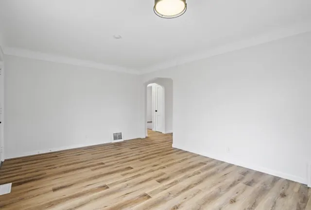 Living room with new wood-look flooring and fresh paint, Twin Cities