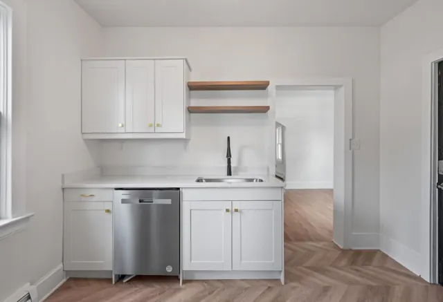 White shaker cabinets, floating shelves and gold-finish hardware, St. Paul, MN